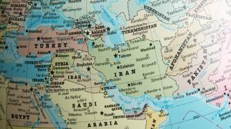 Middle East map on a globe focused on Iran, Turkmenistan, Afghanistan