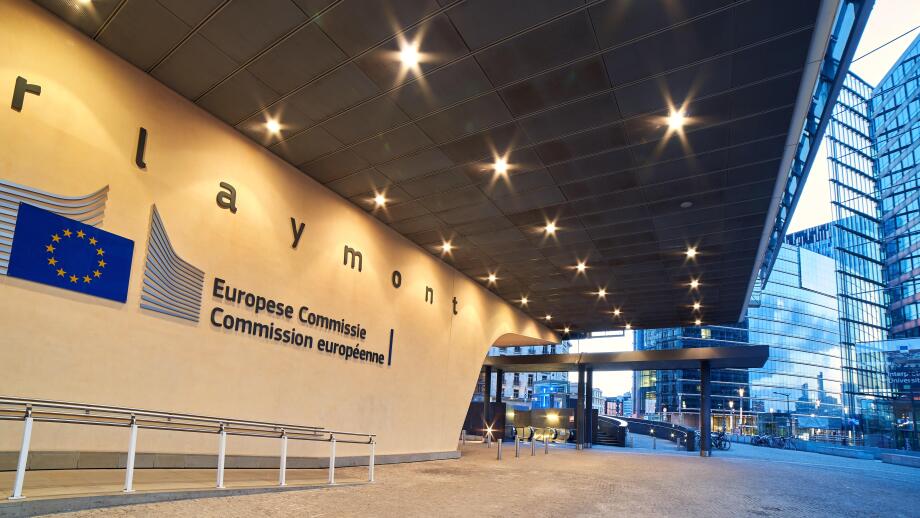 Entrance of the Berlaymont building, headquarters of the European Commission with the organization logo.