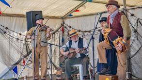 Great Yarmouth, Norfolk, UK ? September 08 2019. A folk band made up of one lady and three men during a performance at the Great Yarmouth Maritime Fes