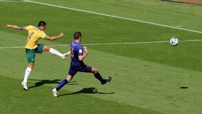 FILE - In this June 18, 2014 file photo, Australia's Tim Cahill, left, scores his side's first goal during the group B World Cup soccer match between Australia and the Netherlands at the Estadio Beira-Rio in Porto Alegre, Brazil. Shortly after Australia f