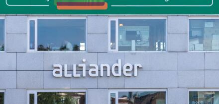 Arnhem, The Netherlands - October 1, 2025: Office of Alliander Energy with the Dutch text for "Working at alliander makes the energy network better"