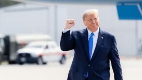 Greenville, S.C., USA - October 15 2020: Donald Trump walking outdoors, raising his fist in a gesture of triumph
