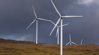 Windmills producing alternative energy near Kenmare, County Kerry, Republic of Ireland.