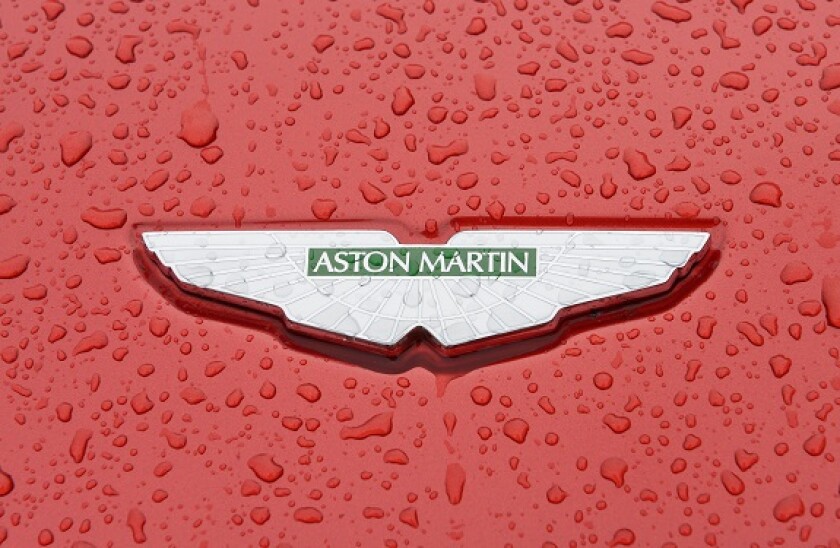 Aston Martin car badge close up on a wet bonnet