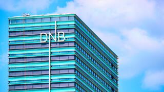 Vilnius, Lithuania - May 6, 2017: Office of DNB bank at modern skyscraper in downtown, Vilnius, Lithuania