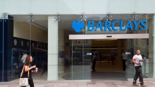 People outside Barclays bank one looking back at the other, Cardiff, Wales, UK
