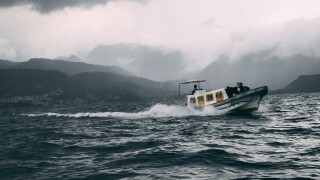 boat in rocky waters on lake