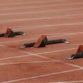 starting blocks on start line of running track stadium