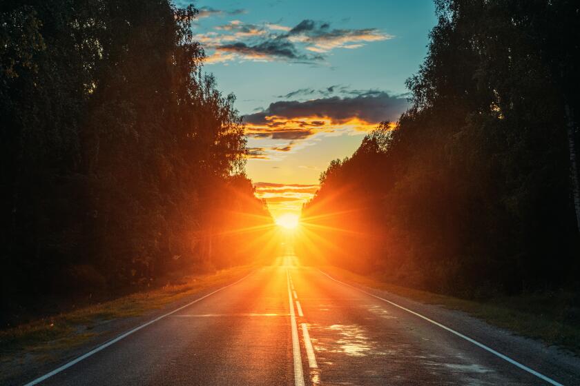 Sun Rising Over Asphalt Country Open Road In Sunny Morning Or Evening. Open Free Road In Summer Or Autumn Season At Sunny Sunset Or Sunrise Time