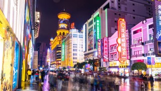 SHANGHAI, CHINA - DEC 22, 2019 : Nanjing Road is the main shopping streets of Shanghai, Neon signs light on Nanjing Road. The area is the main shopping one of the world's busiest shopping streets.