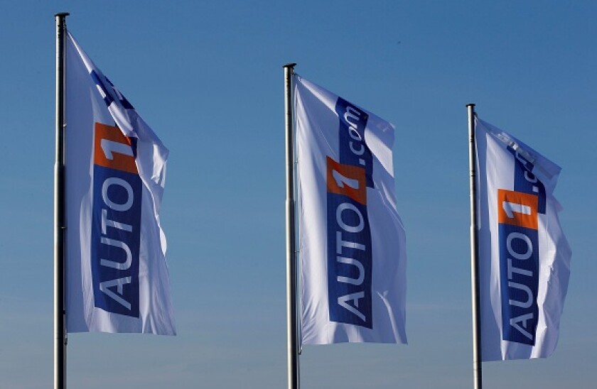 Flags with the logo of Auto1.com are pictured at the company grounds in Zoerbig, Germany January 28, 2017. Picture taken January 28, 2017. REUTERS/Fabrizio Bensch