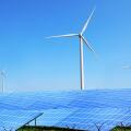 Solar panels and wind turbines in field. Concept of eco friendly thechnologies