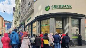 People waiting in line outside the branch of Russian bank Sberbank in Brno, Czech Republic, February 25, 2022. In connection with the Russian army's a