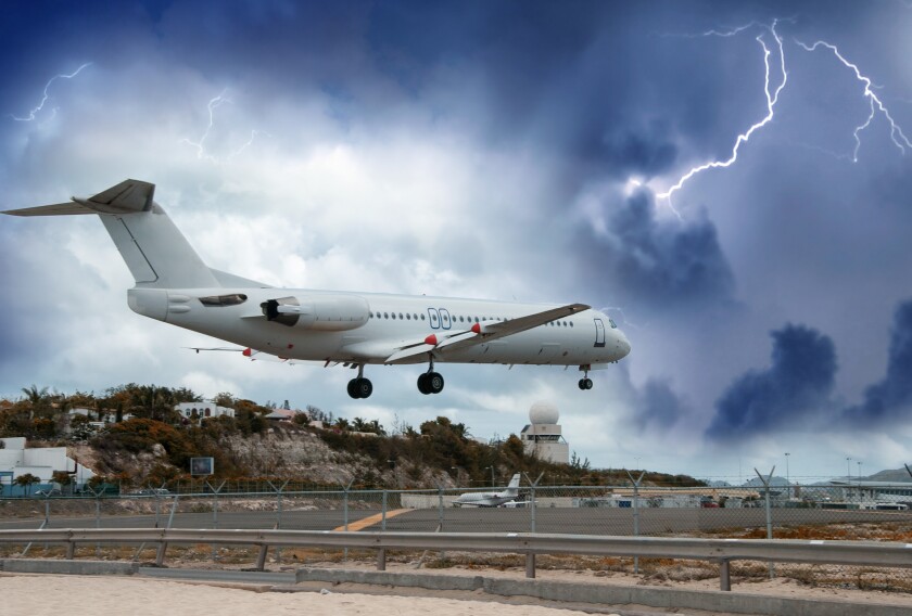 Airplane landing in the storm _Oct 19 2021 adobe