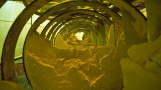 Yellow cake, powdery uranium oxide in Burwell filter press, Uranium City, Saskatchewan, Canada, North America