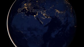 Full Earth showing city lights of Africa, Europe, and the Middle East.