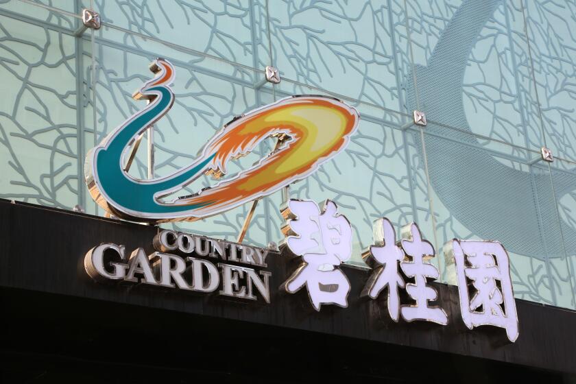 --FILE--View of a signboard of Country Garden at the sales center of a residential property project developed by Country Garden in Shanghai, China, 21