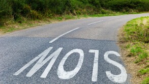 Slow sign on bend in road, Cornwall UK Credit: David Levenson