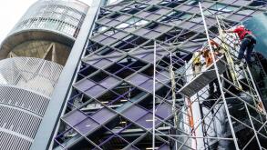 Mexico City,Colonia Cuauhtemoc,Hispanic,immigrant immigrants,Mexican,under new construction site building builder site,Torre BBVA Bancomer,scaffolding