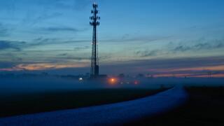 FOG SETTING IN OVER FARM LANE AND FIELDS WITH CELL TOWER, LITITZ PENNSYLVANIA