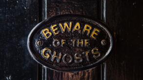 A Beware of the Ghosts plaque on the entrance to the Golden Fleece public house in York, England. It is regarded to be the most