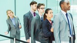 Business people waiting in line