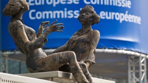 European Commission building with chatting ladies artwork at the entrance