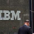 A businessman walks past the IBM building at 590 Madison Ave, New York in Midtown Manhattan.