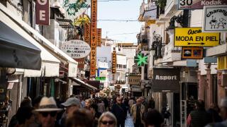 NOVEMBER 10, 2017 - TORREMOLINOS, SPAIN. Crowds of tourists on a busy shopping street ,Calle san Miguel in the centre of Torremolinos
