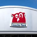 Montreal, Canada - April 4, 2020: Couche-Tard logo on a building over a blue sky. Couche-Tard, is a Canadian multinational operator of convenience sto