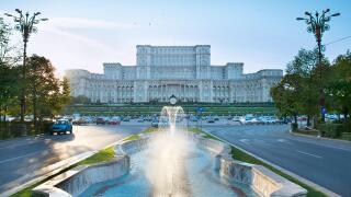 Bucharest Parliament with fountain in front of it. Romania