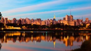 Sao Paulo skyline at sunset seen from Ibirapuera Park ( Parque Ibirapuera) a major urban park of the city, Brazil.
