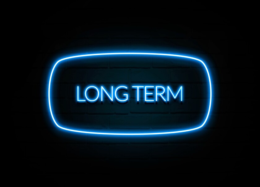 Long Term  - colorful Neon Sign on brickwall