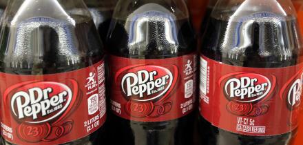 FILE - This April 28, 2016, file photo shows bottles of Dr. Pepper on a store shelf at Quality Cash Market in Concord, N.H. Keurig is buying Dr. Pepper Snapple Group Inc. to create a beverage business with approximately $11 billion in annual sales, announ