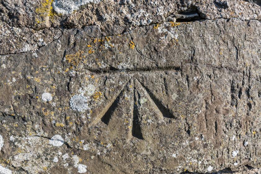 Old surveyors benchmark in stone structure