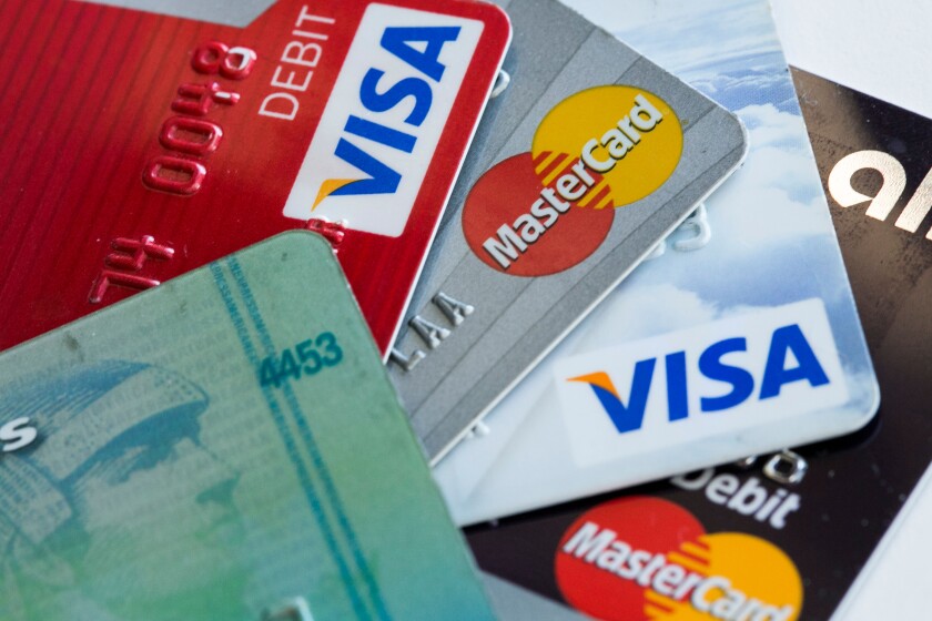 Arranged photos of various U.S. credit cards from Visa, MasterCard and American Express