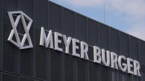 Thalheim, Germany. 18th May, 2021. View of the entrance to the Swiss company Meyer Burger in Thalheim. The production of solar cells starts here with an annual nominal capacity of 400 megawatts. Saxony-Anhalt supports the company's production, according t