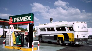 Feb 28, 2002 - Overland coach at a PEMEX filling station in Texcoco outside Mexico-City.