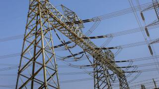 A high-voltage power line masts in Riyadh Province, Saudi Arabia