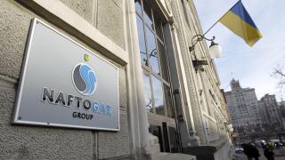 The logo of national oil and gas company Naftogaz Ukraine is seen at the company office entrance, in Kyiv, Ukraine, on 18 December, 2019. (Photo by STR/NurPhoto)