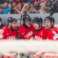 FRIBOURG, FRIBOURG - MAY 28: Canada players celebrate for the first time after Macklin Celebrini scored during the 2026 IIHF World Championship quarterfinal match between Canada and the United States at BCF Arena on May 28, 2026 in Fribourg, Fribourg, Swi