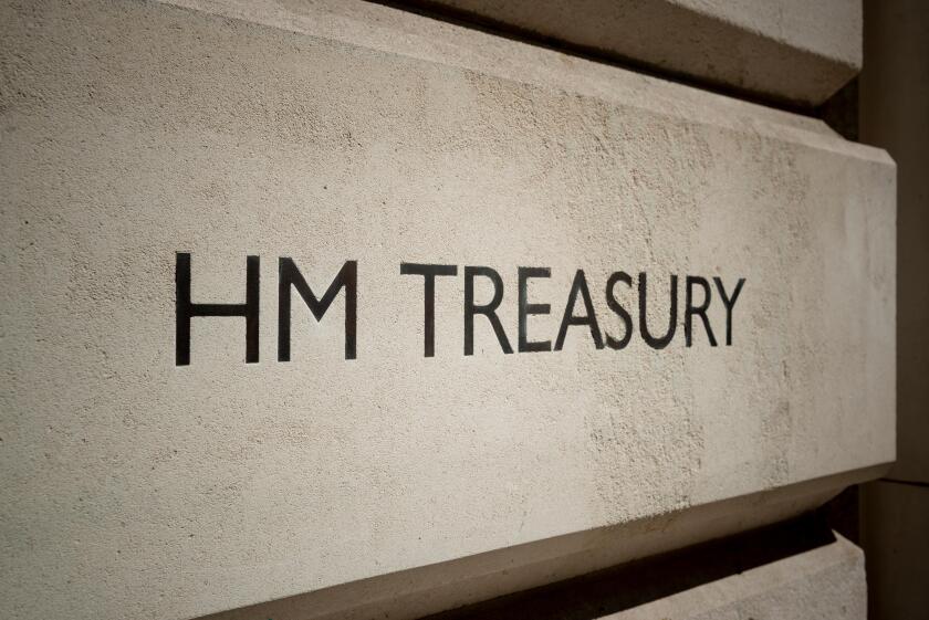 Signage for HM Treasury building located on Horse Guards Road in London, UK.