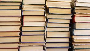 Many old books in a book shop or library,  education and reading concept