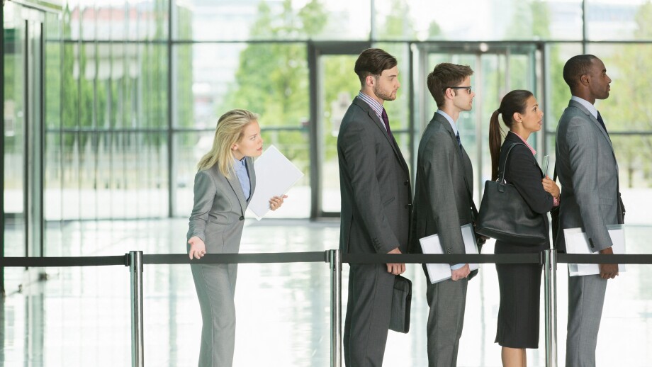 Business people waiting in line