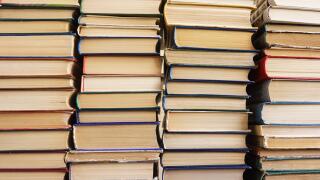 Many old books in a book shop or library,  education and reading concept