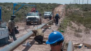 VACA MUERTA, ARGENTINA - Nov 05, 2015: A gas pipeline construction process in Vaca Muerta, Neuquen, Argentina.