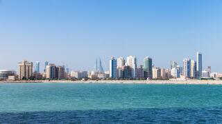 Modern tall buildings on the horizon. Skyline of Manama city, Bahrain