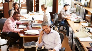 Interior Of Busy Architect's Office With Staff Working