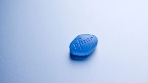 Close up Detail of a 100mg Sildenafil Citrate Pfizer Viagra Pill on silver background