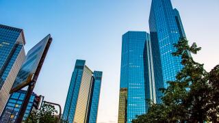 View to the tall glass buildings from the street road